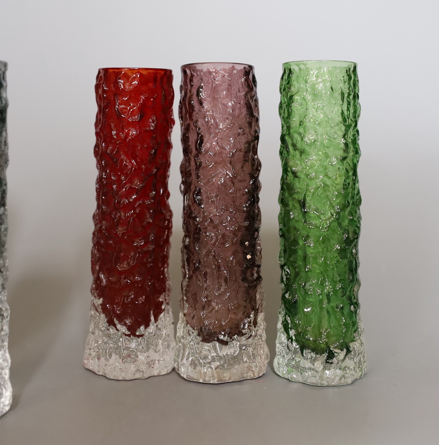 A group of eight Whitefriars 'bark' vases designed by Geoffrey Baxter, various colours, two 15cm high, six 14cm high.